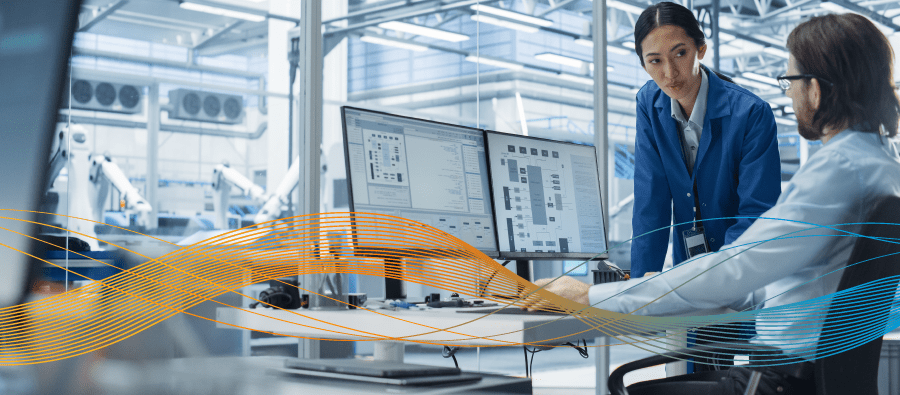 Two engineers discussing predictive maintenance in factory
